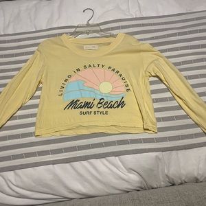 surf style yellow miami beach cropped long sleeve tee